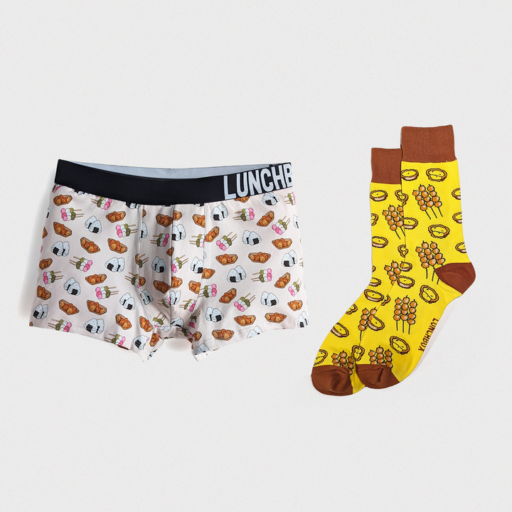 Japanese Delights boxer briefs with dango and onigiri designs, and Flavours of Hong Kong socks featuring curry fish balls and egg tart designs.